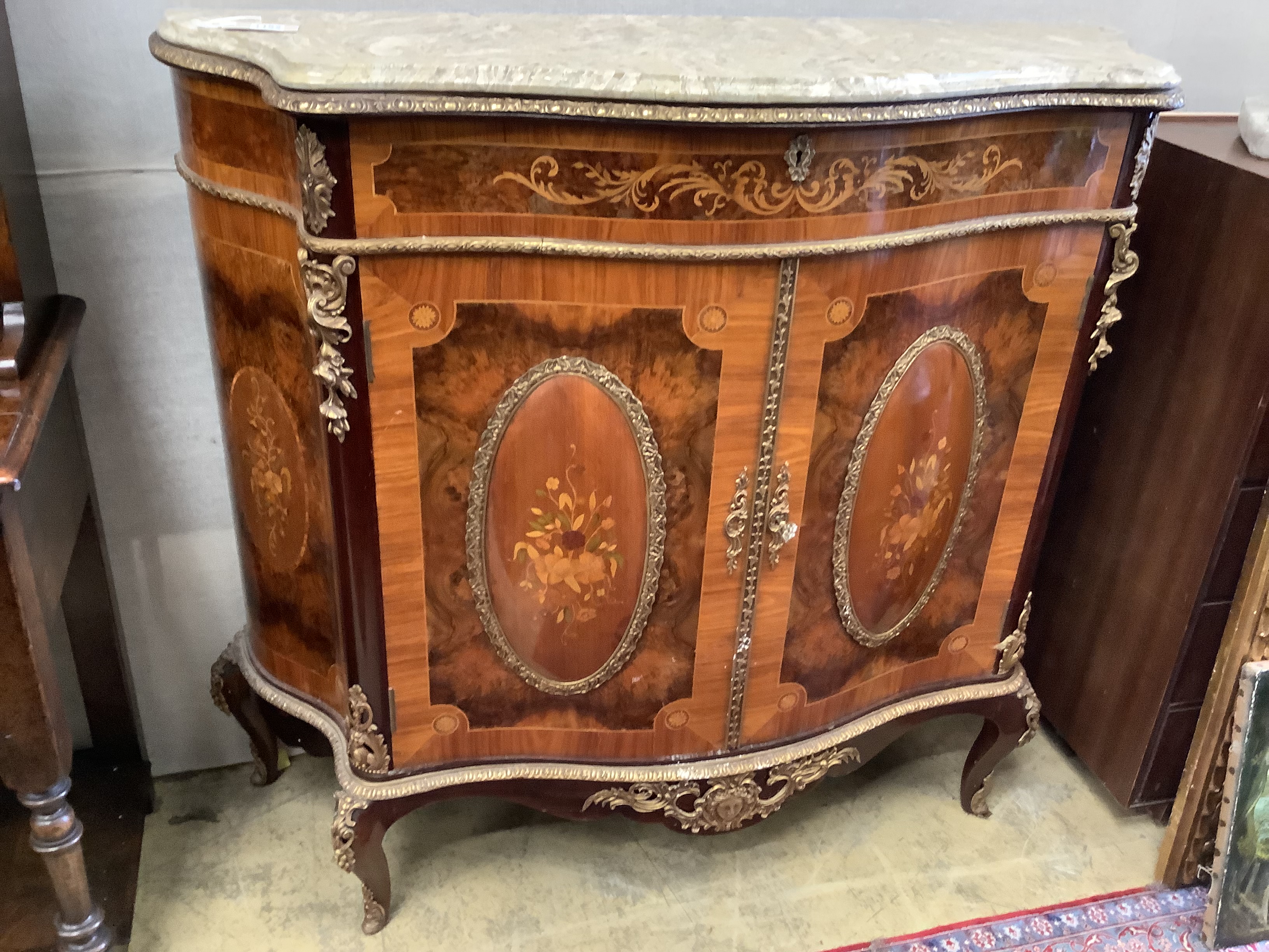 A Louis XV design walnut, kingwood and marquetry inlaid serpentine cabinet, length 116cm, depth 43cm, height 108cm